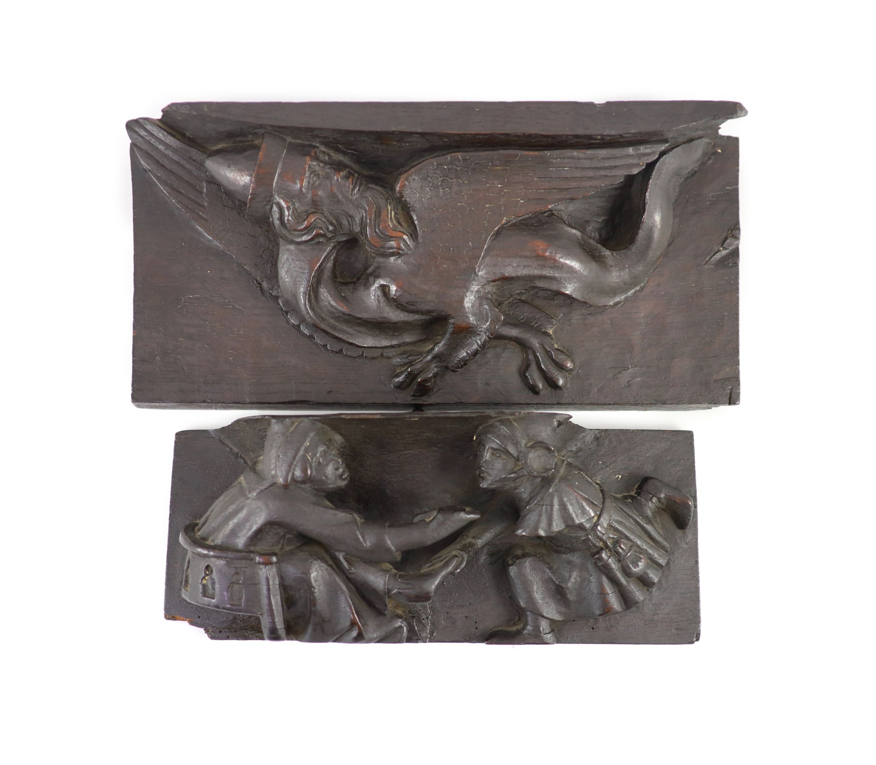 Two carved oak misericord panel fragments, 15th/16th century, the longest 40 x 17cm.